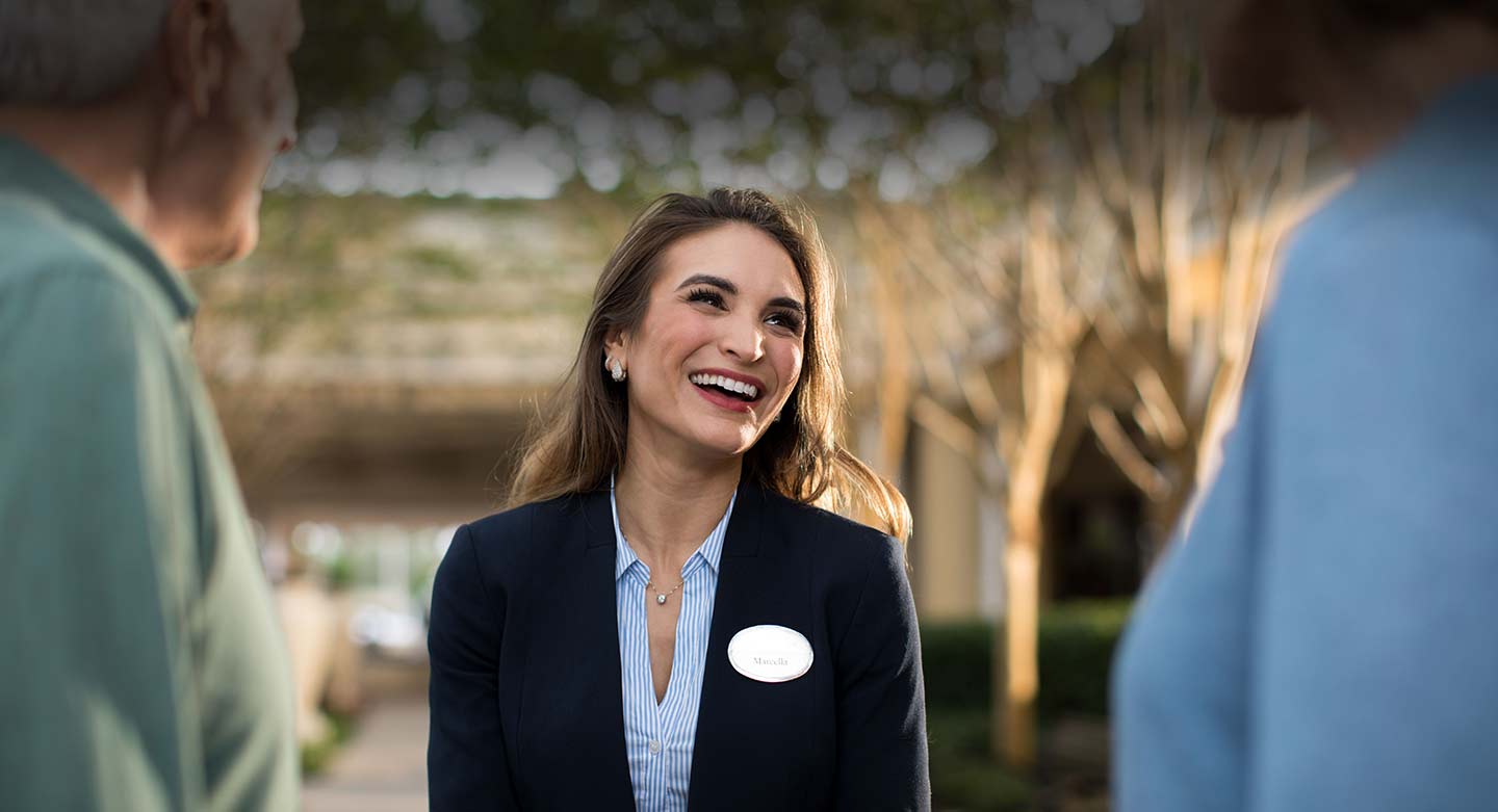 Team Member greeting owners